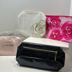 Bundle of four Lancôme cosmetic bags
